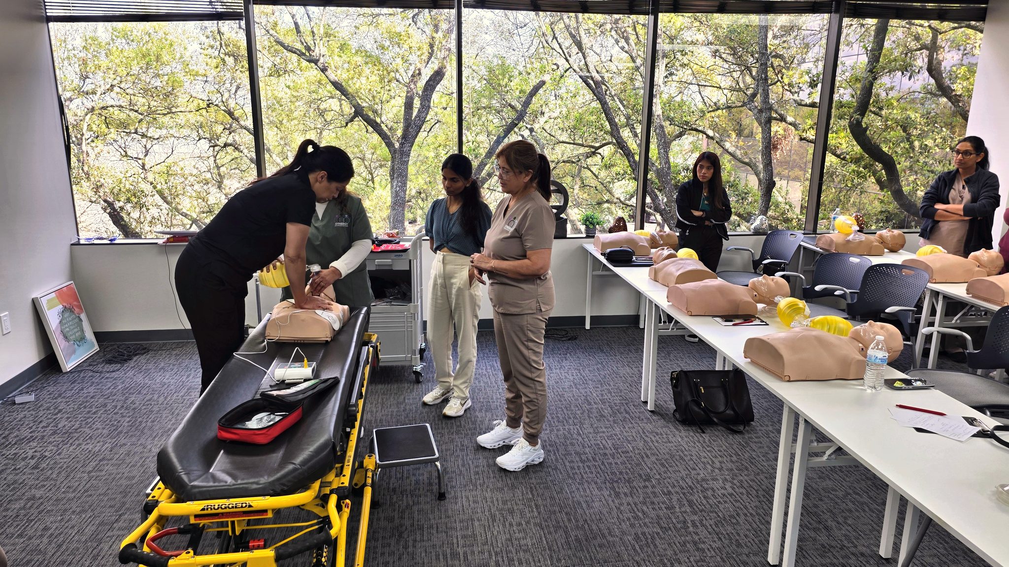 Cardiox Care CPR training classroom in Houston with organized desks and training equipment.